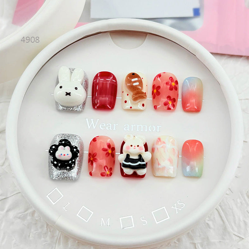 zb34..A collection of almond-shaped and square-shaped wearable nails